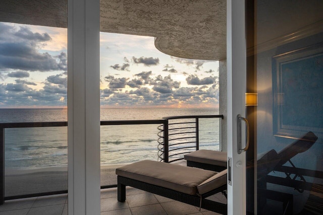 balcony at dusk with a water view