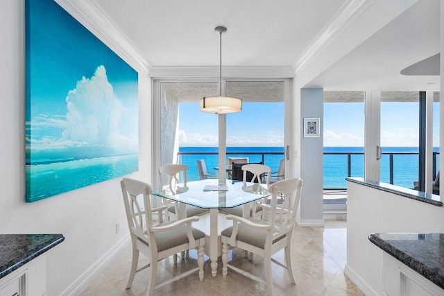 dining area featuring floor to ceiling windows, a healthy amount of sunlight, crown molding, and a water view