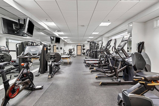 workout area featuring a paneled ceiling