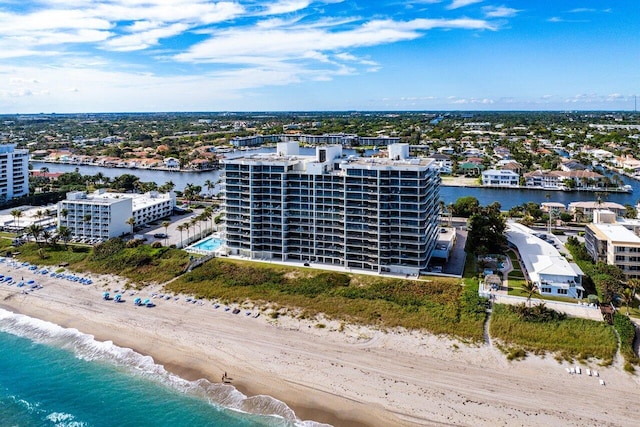 aerial view featuring a view of the beach and a water view