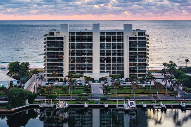 outdoor building at dusk featuring a water view