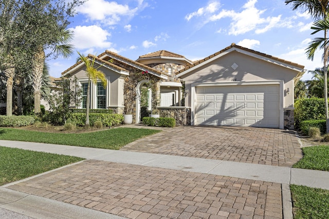 mediterranean / spanish house featuring a garage