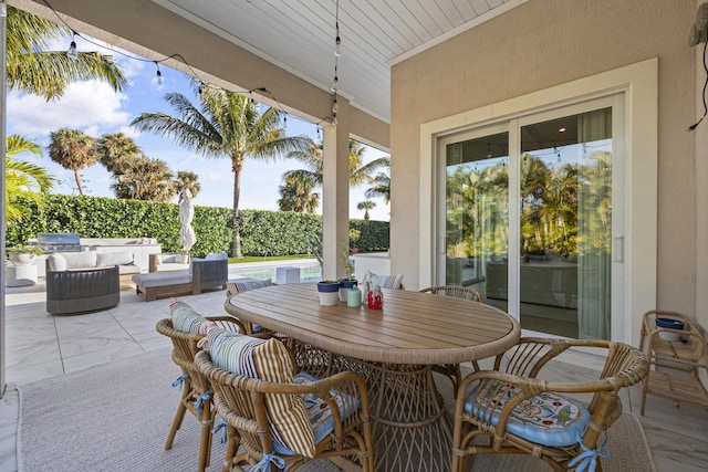 view of patio with a pool and a grill