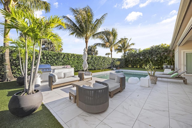 view of patio featuring a fenced in pool, area for grilling, and grilling area