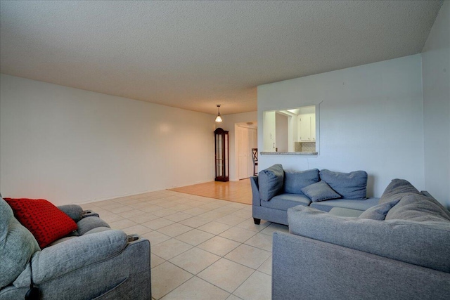 tiled living room with a textured ceiling