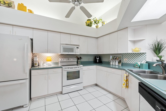 kitchen with white cabinets, white appliances, and sink