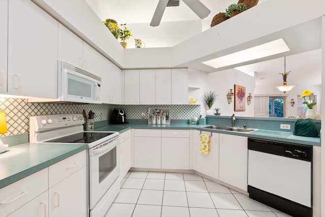 kitchen featuring tasteful backsplash, white appliances, sink, white cabinetry, and light tile patterned flooring