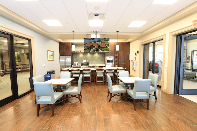 dining space featuring dark hardwood / wood-style flooring