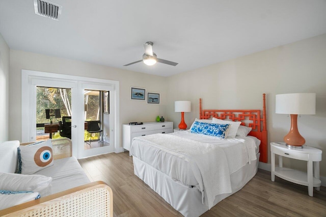 bedroom with access to outside, french doors, light wood-style flooring, and visible vents