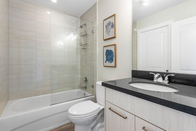 full bathroom with  shower combination, vanity, and toilet