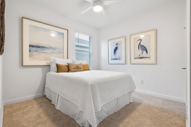 bedroom featuring ceiling fan and light colored carpet