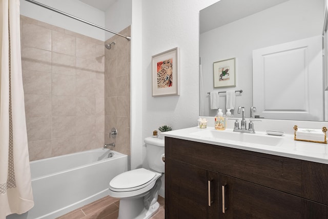 full bathroom featuring vanity, toilet, and shower / tub combo