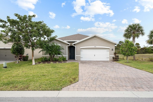 single story home featuring a front lawn and a garage