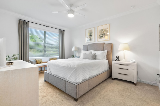 bedroom featuring ceiling fan, crown molding, and light carpet