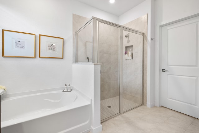 bathroom with shower with separate bathtub