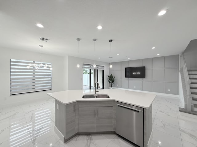 kitchen featuring gray cabinetry, a large island, sink, hanging light fixtures, and stainless steel dishwasher