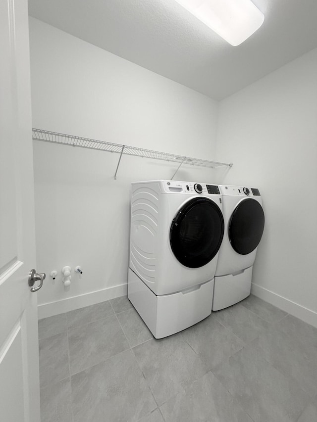 washroom featuring independent washer and dryer