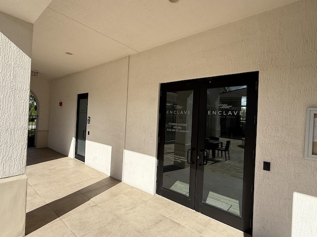 property entrance featuring french doors