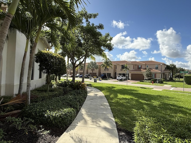 view of home's community featuring a lawn