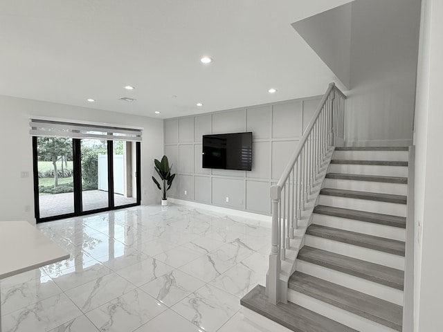 stairway featuring french doors