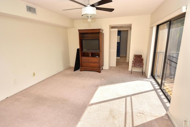 unfurnished bedroom with ceiling fan, light colored carpet, access to outside, and multiple windows