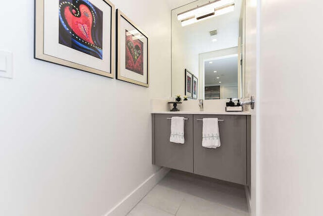 bathroom with tile patterned floors and vanity