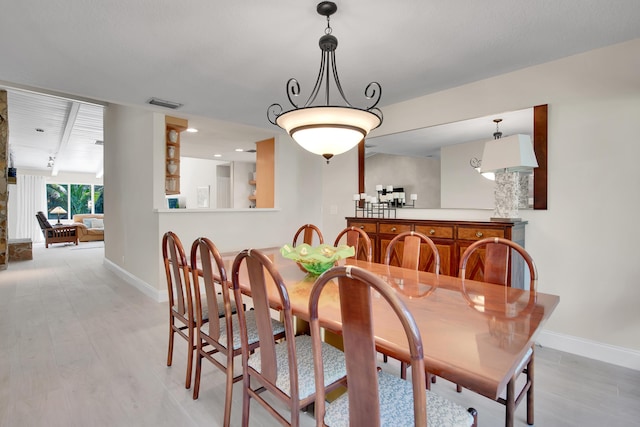 dining space featuring light hardwood / wood-style floors