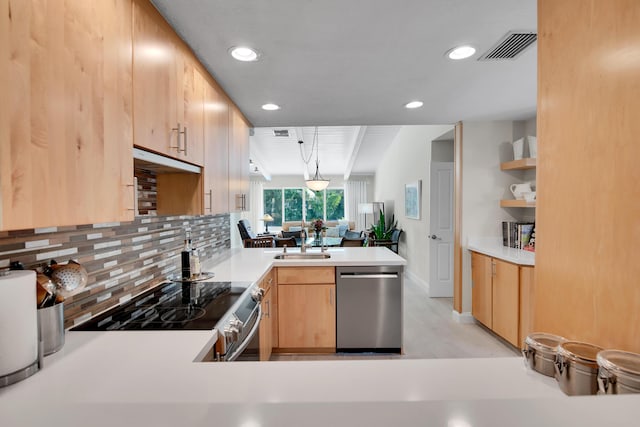 kitchen with light brown cabinets, kitchen peninsula, pendant lighting, decorative backsplash, and appliances with stainless steel finishes