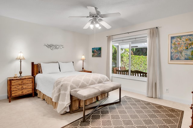 bedroom with tile patterned floors and ceiling fan