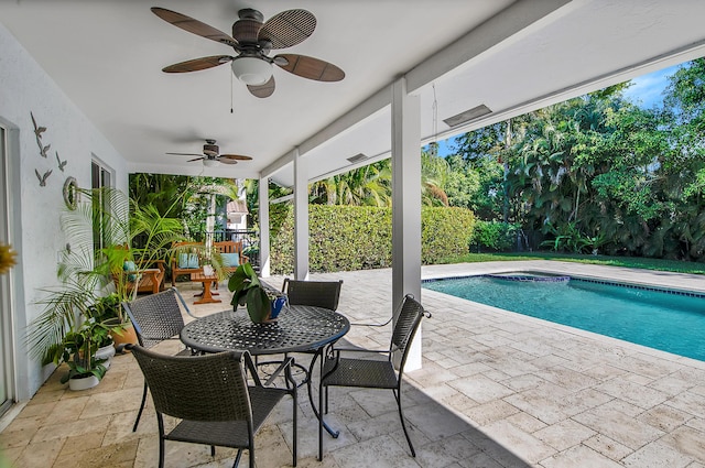 view of pool with ceiling fan and a patio area