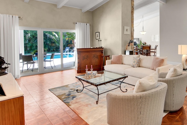 living room featuring beamed ceiling and high vaulted ceiling