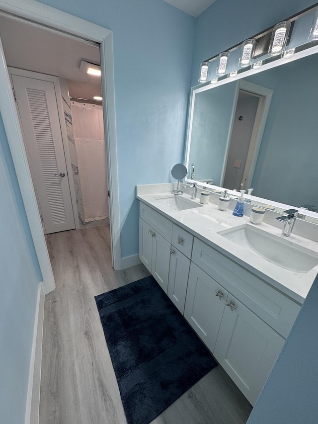 bathroom featuring hardwood / wood-style floors and vanity