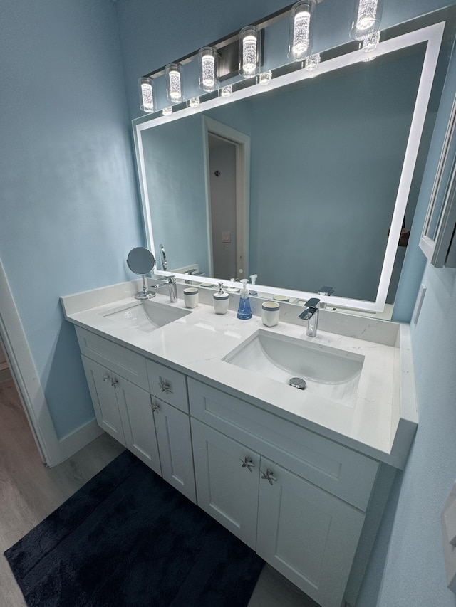 bathroom featuring vanity and hardwood / wood-style flooring