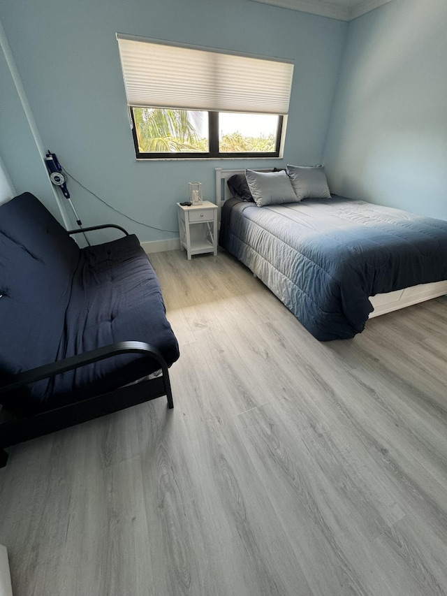 bedroom with light wood-type flooring