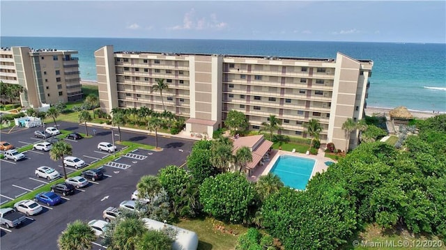 birds eye view of property with a water view