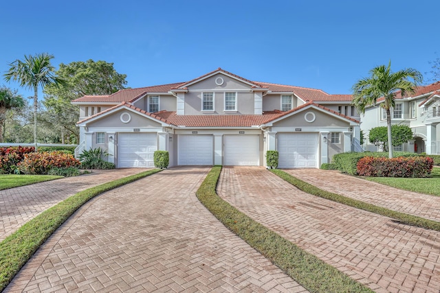 view of front of property with a garage