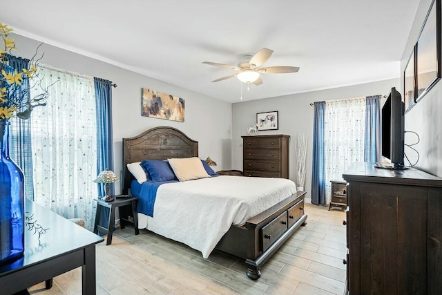 bedroom featuring ceiling fan and light wood-type flooring