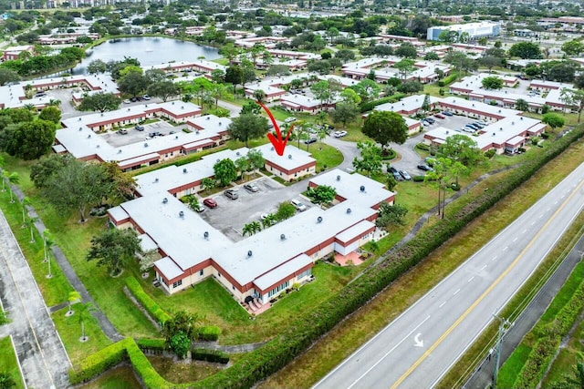 drone / aerial view featuring a water view