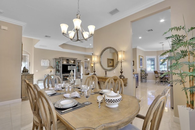 tiled dining area with ornamental molding and an inviting chandelier