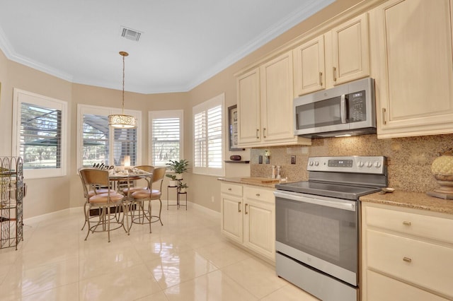 kitchen with tasteful backsplash, crown molding, hanging light fixtures, and appliances with stainless steel finishes