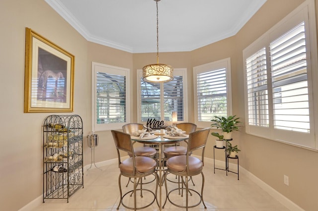 tiled dining space featuring ornamental molding