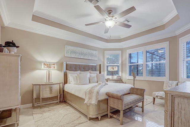 bedroom with light tile patterned floors, a tray ceiling, ceiling fan, and ornamental molding