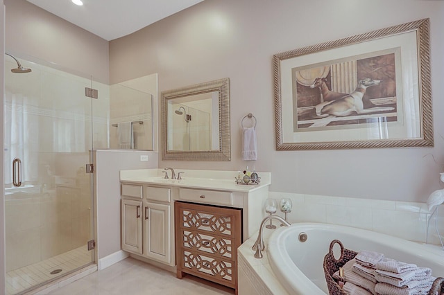 bathroom featuring plus walk in shower and vanity