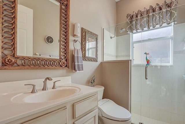 bathroom with vanity, toilet, and an enclosed shower