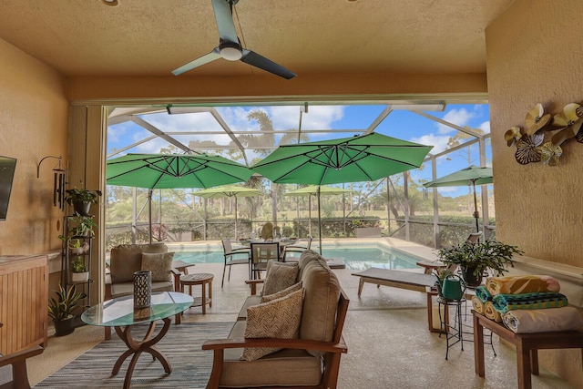 view of patio / terrace with ceiling fan and a lanai