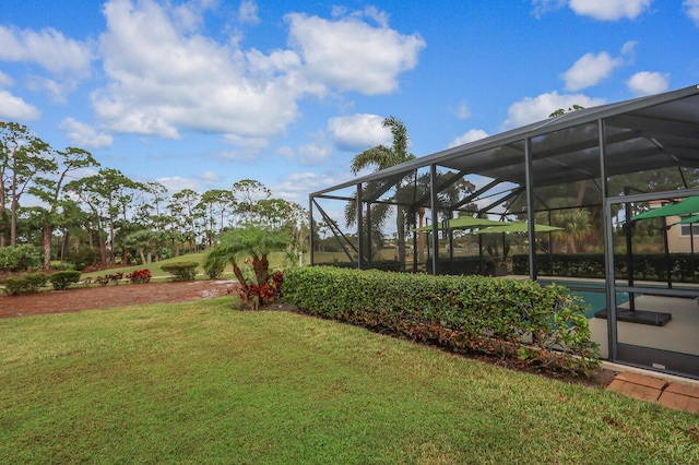 view of yard with glass enclosure