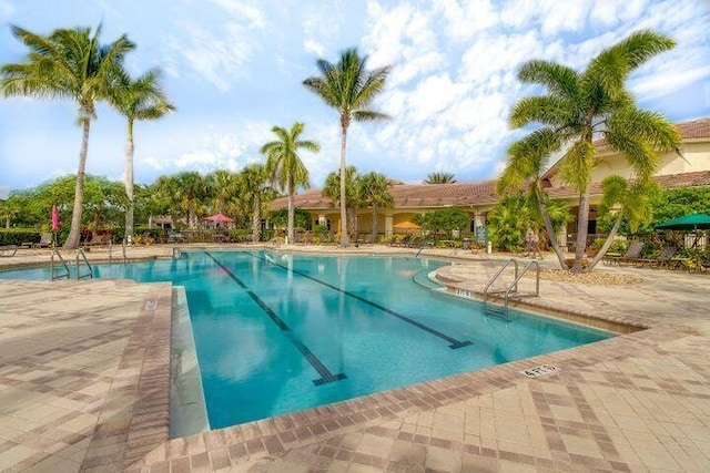 view of swimming pool featuring a patio area