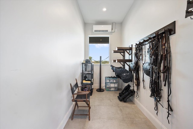 corridor featuring an AC wall unit