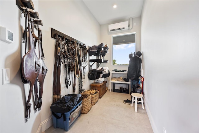 interior space with a wall mounted air conditioner