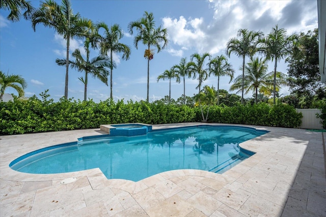 view of swimming pool with an in ground hot tub and a patio area